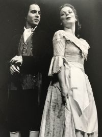 Black and white photo of male and female dressed in Edwardian clothes