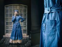 On left photo of actress wearing blue work smock and hat, smoking. On right close up of pocket and belt detail.