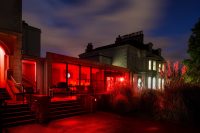 Main building with red lighting installation