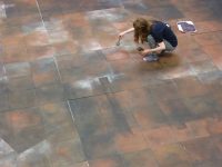 Scenic Art student painting a floor