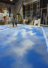 Scenic Art students creating a sky floor