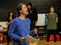 Female student holding a script in rehearsal